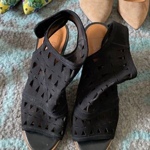 Strap back black suede heels